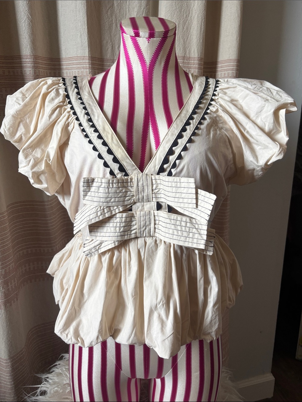 Peach Love California Cream Puff-Sleeve Peplum Top with Black Trim & Front Bow